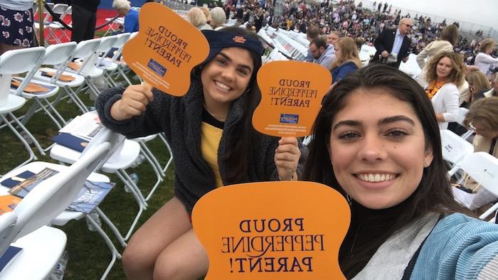 McGrath (left) and her sister Erika support their brother Jack at Pepperdine's graduation last May. She said because her brother went to Pepperdine, she didn't consider the school at first.