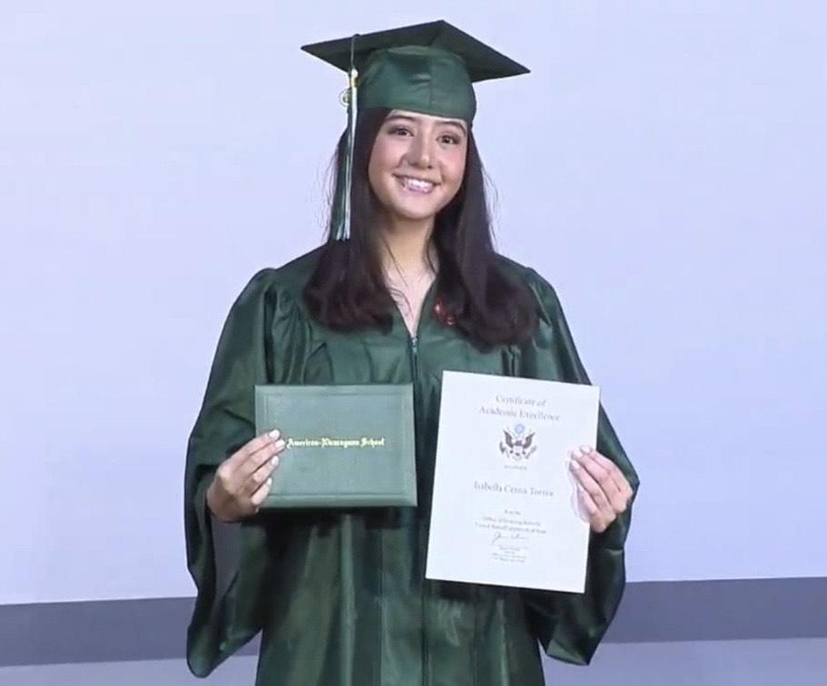 Cerna smiles for graduation pictures at her high school’s drive-thru graduation ceremony in June. International Business major Cerna said she enjoys learning about business and economics.
