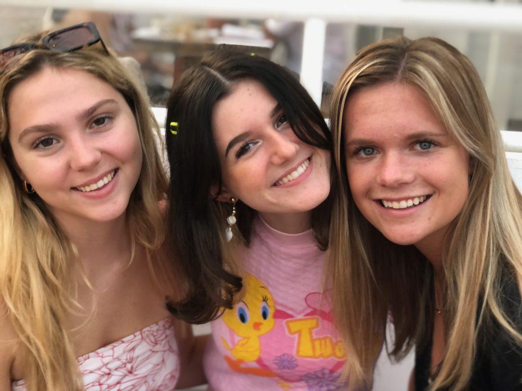 Cullen (right) poses with her roommates, first-years Emerson Glancy (left) and Sophie Tarditi (middle), at a restaurant on the Malibu Pier in early September. Cullen said she moved to California because she would have felt too secluded at home and wanted to meet new people.