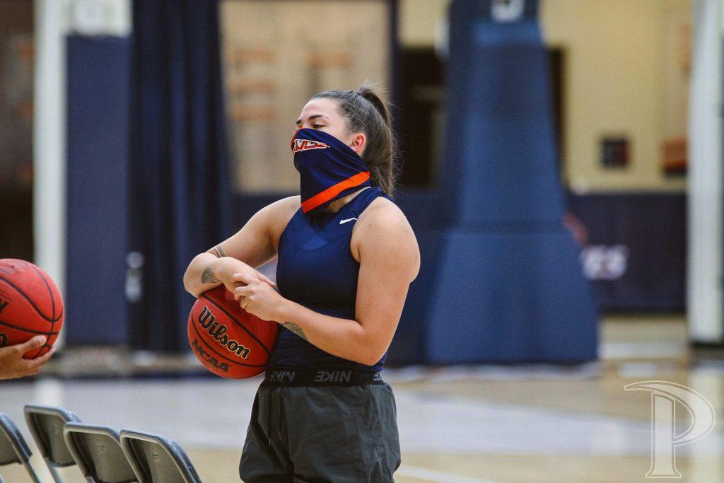 Freshman Isabel Montoya listens to a coach about plays and offensive styles during an Oct. 9 practice in Firestone Fieldhouse. Montoya said the team is trying their best to thrive under COVID-19 obstacles and restrictions. Photo courtesy of Pepperdine Athletics