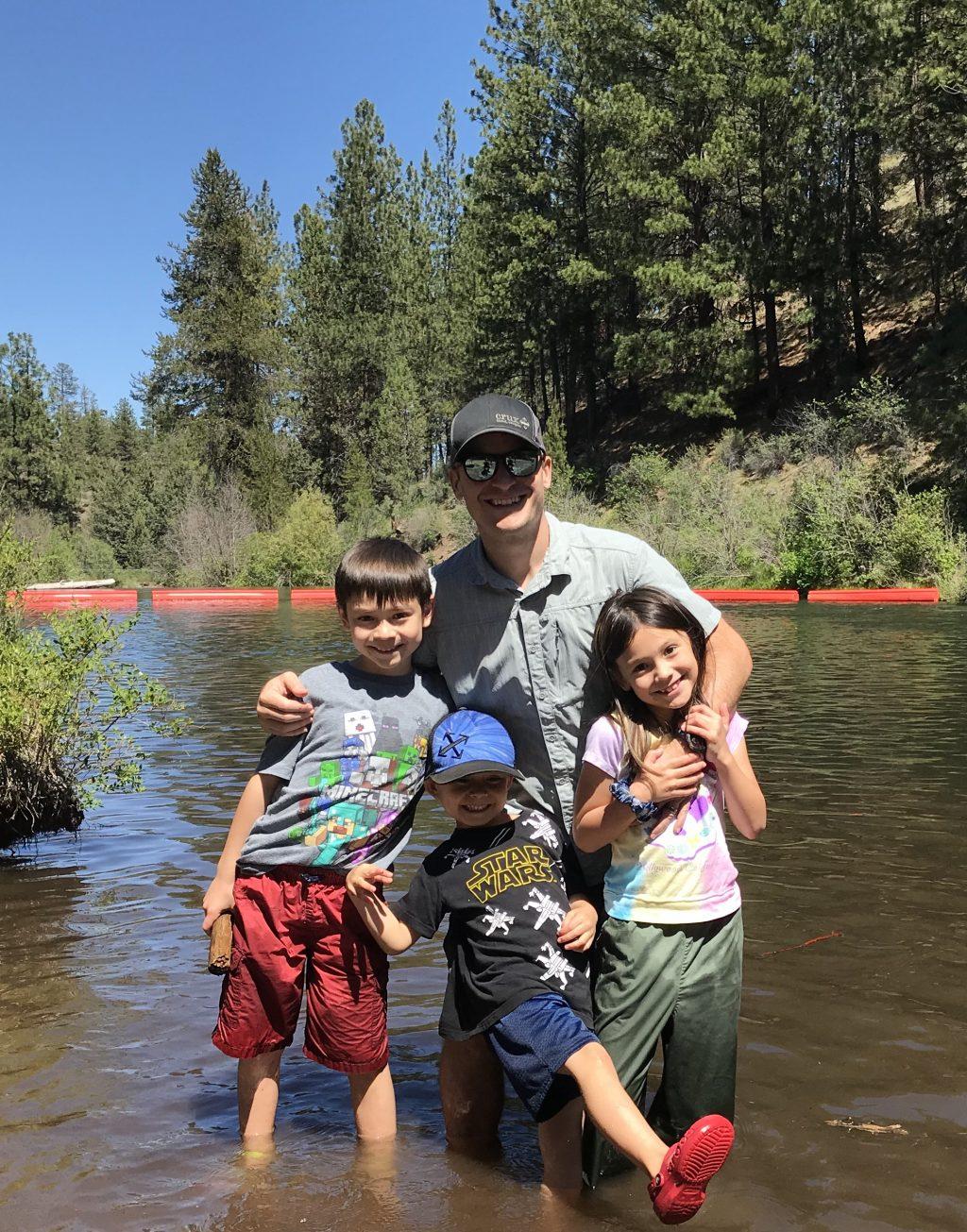 Engelmann and his three children smile for a photo in Oregon in June. Unable to return home to Shanghai, the Engelmann family lived in the Pacific Northwest for five months.