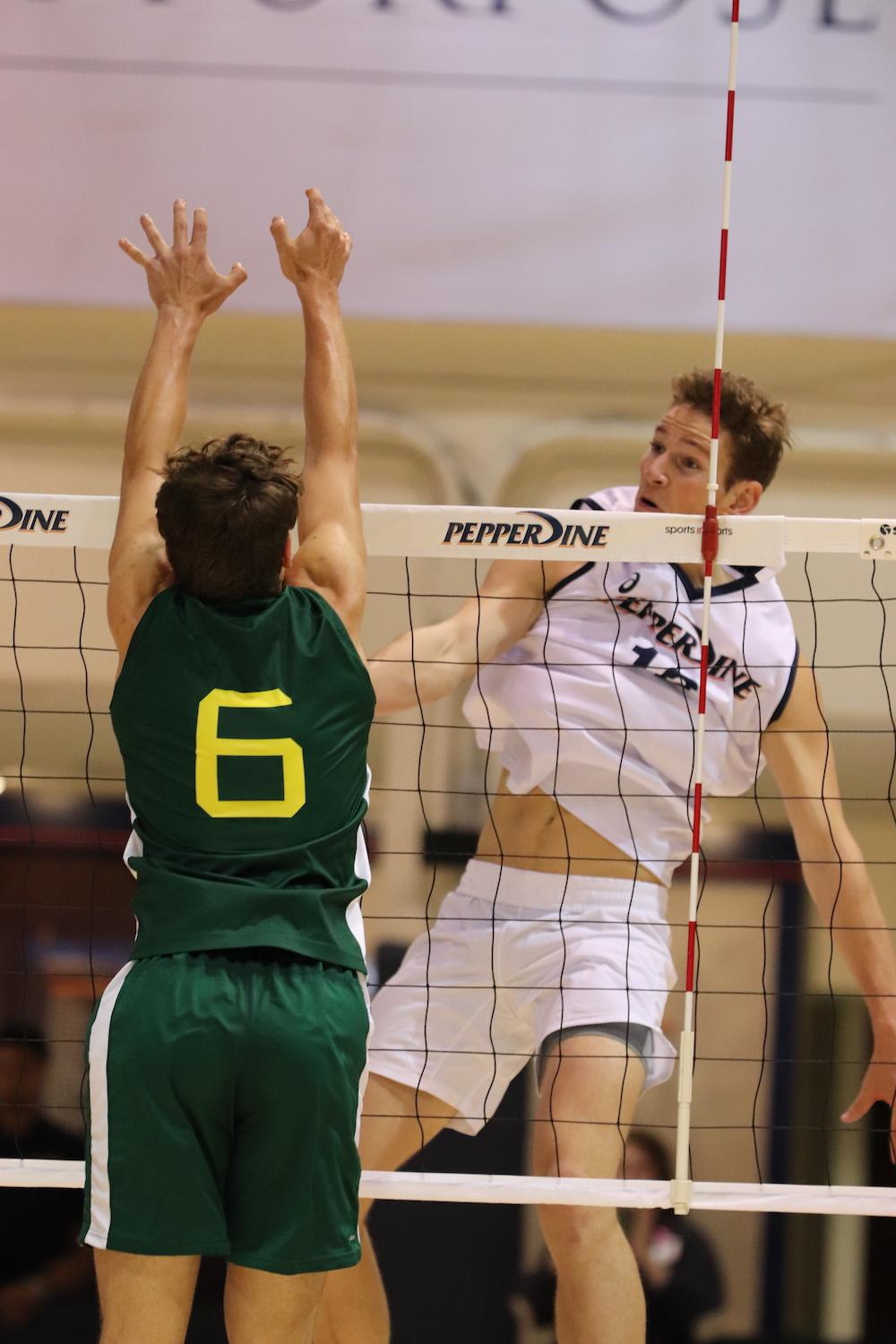Redshirt sophomore opposite Jacob Steele smashes a kill at a home match against CUI. Pepperdine narrowly defeated the Eagles in five sets on Feb. 12. Photo by Ali Levens