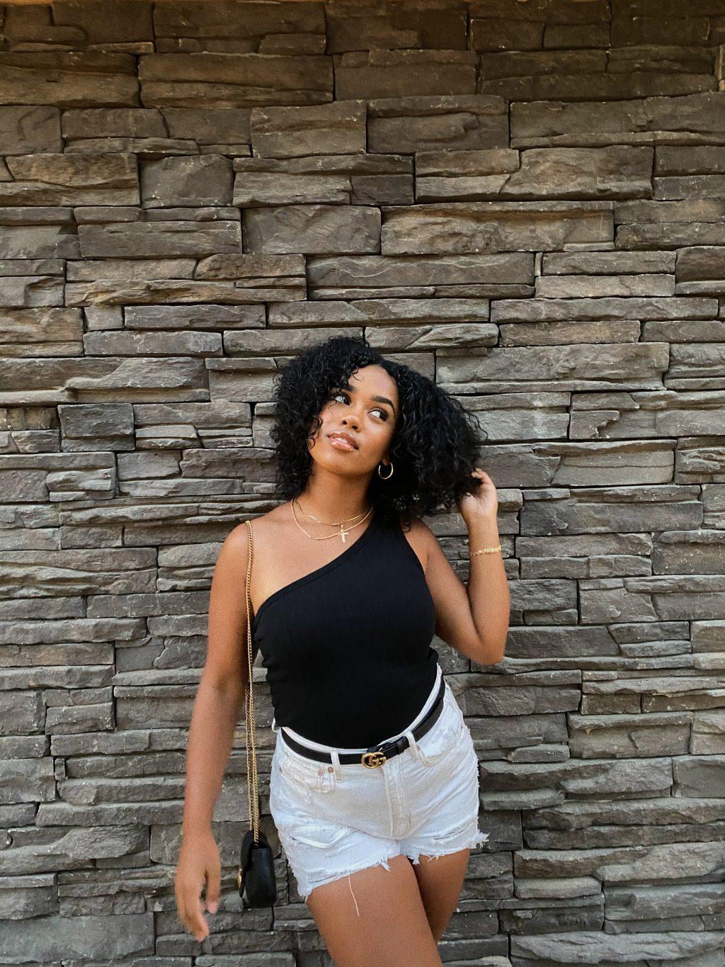Junior Camryn Moss wears a black top from Nordstrom and American Eagle midi-shorts paired with gold accessories before going to dinner in Palm Springs, CA, in September. Moss said she doesn't go anywhere without wearing her gold jewelry, which includes her necklaces and hoops. Photo courtesy of Camryn Moss
