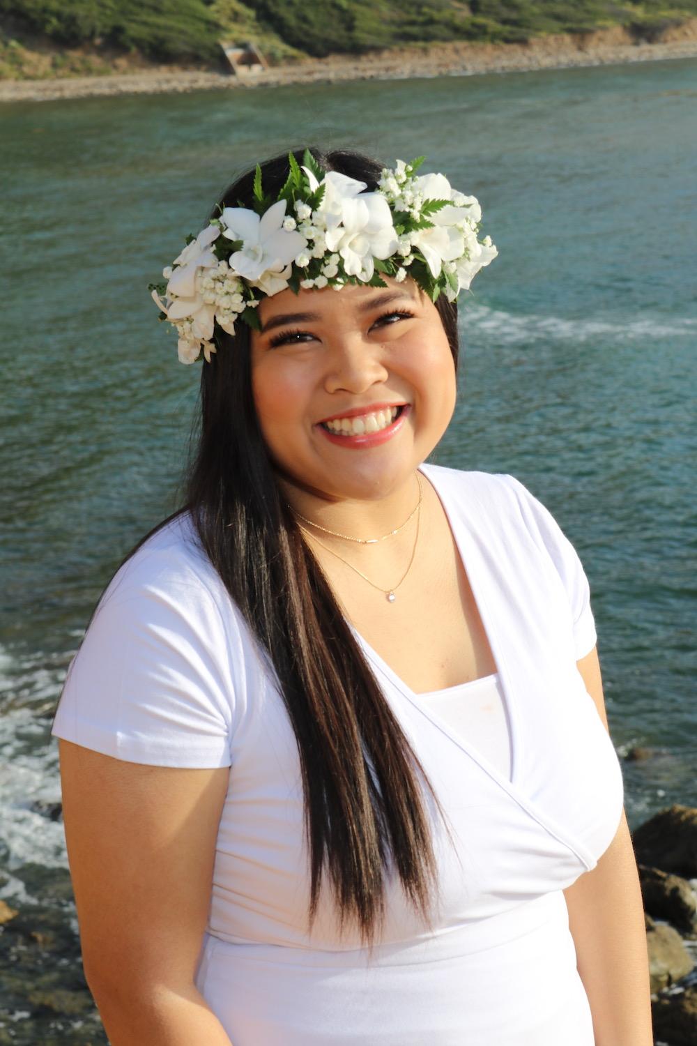 Kiaaina wears a white haku lei, a Hawai'ian flower crown worn in times of celebration, in Palos Verdes, CA, in June. Kiaaina said her aunt sent her the lei from Hawai'i, and even though her graduation ceremony was canceled, Kiaaina still wanted to celebrate by embracing her culture.