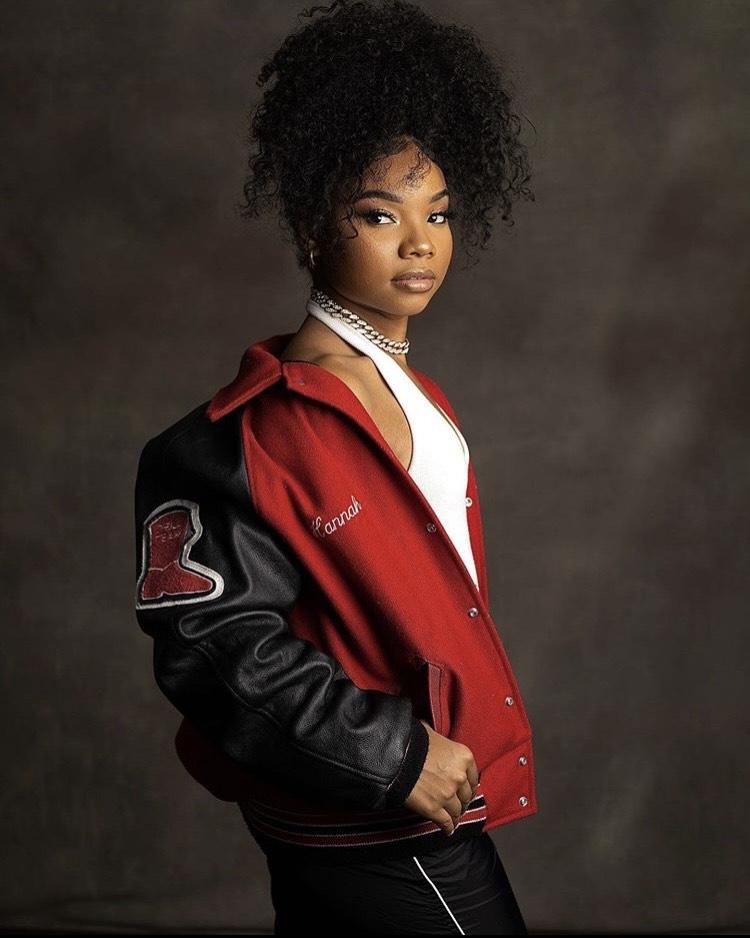 Communication Studies major Hannah Ethridge poses with her varsity jacket to commemorate her high school graduation in May in Dallas, Texas. She said she is very passionate about creating her own dance and fitness company with her degree. Photo courtesy of Hannah Ethridge