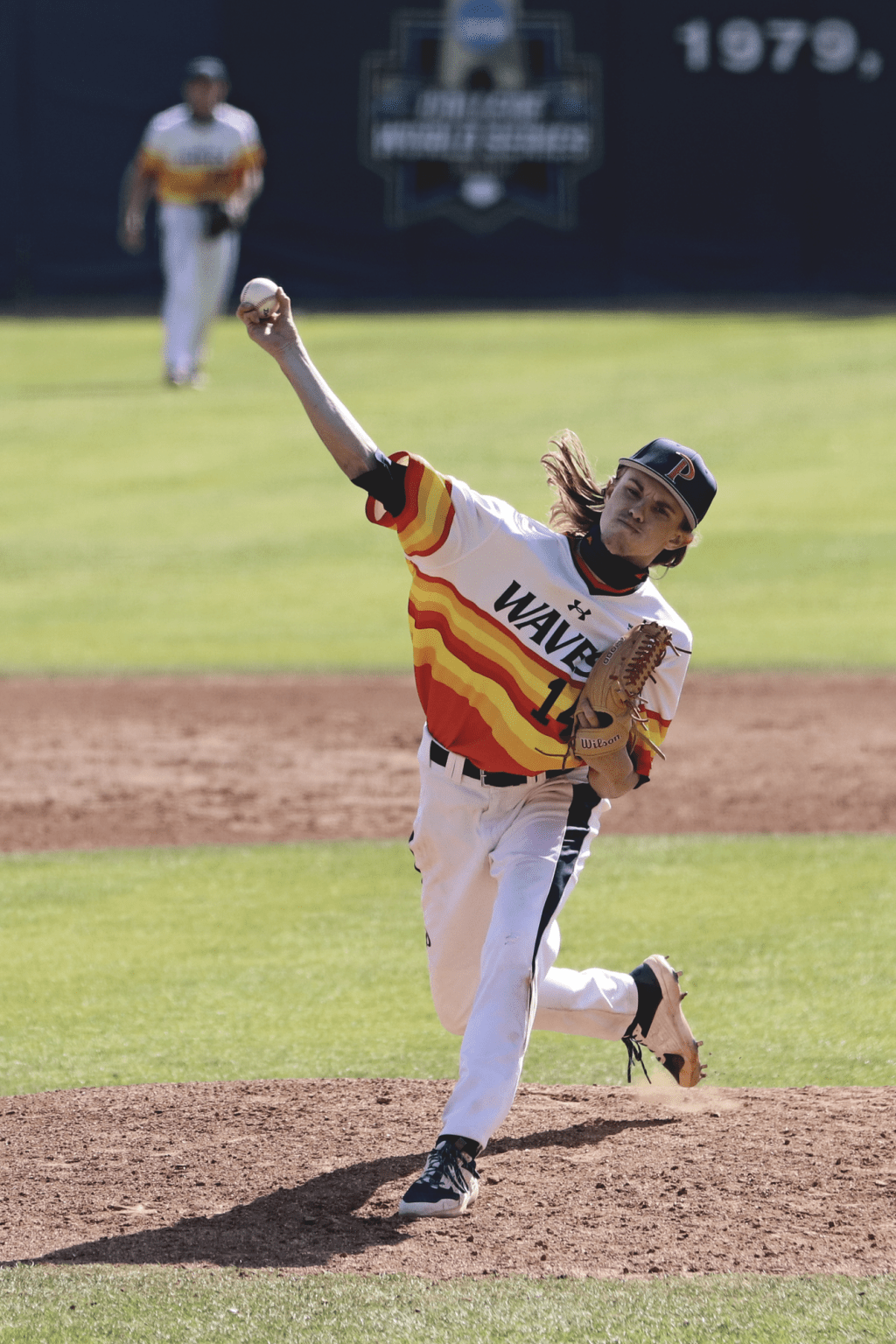 Freshman right-hander Brandon Llewellyn lunges off the mound for a pitch in the third inning against the Gauchos. The pitcher allowed 3 hits and 1 unearned run during Sunday's game.