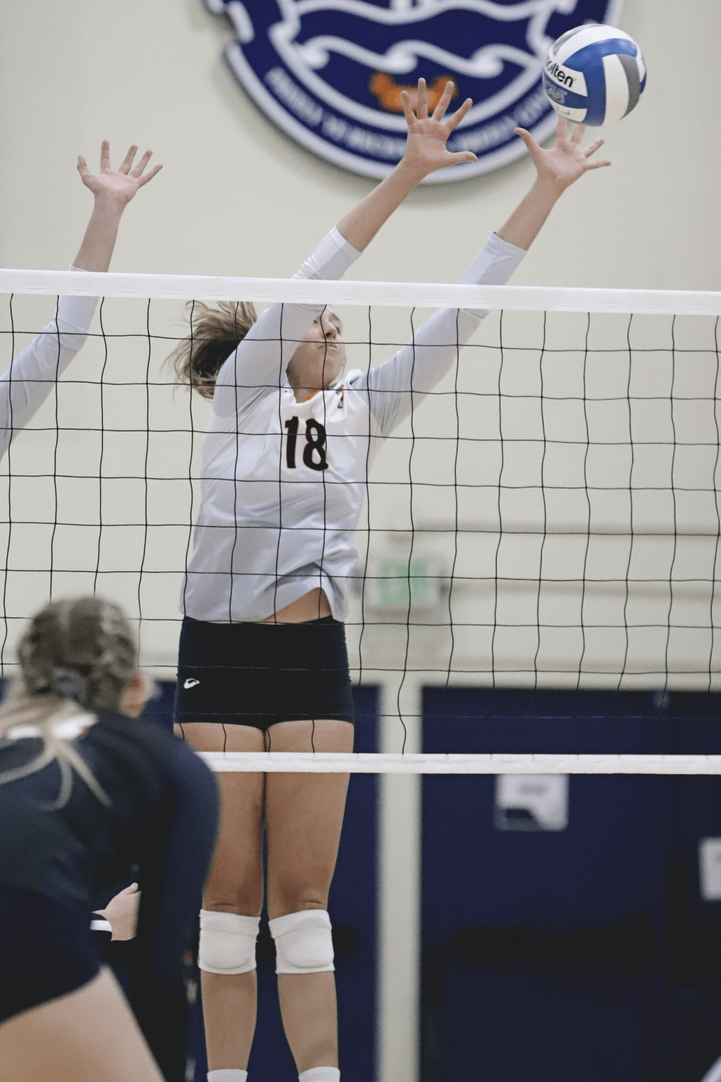 Junior outside hitter Rachel Ahrens extends for a block in Friday's match. Ahrens earned the WCC Offensive Player of the Week honor for the second straight week.