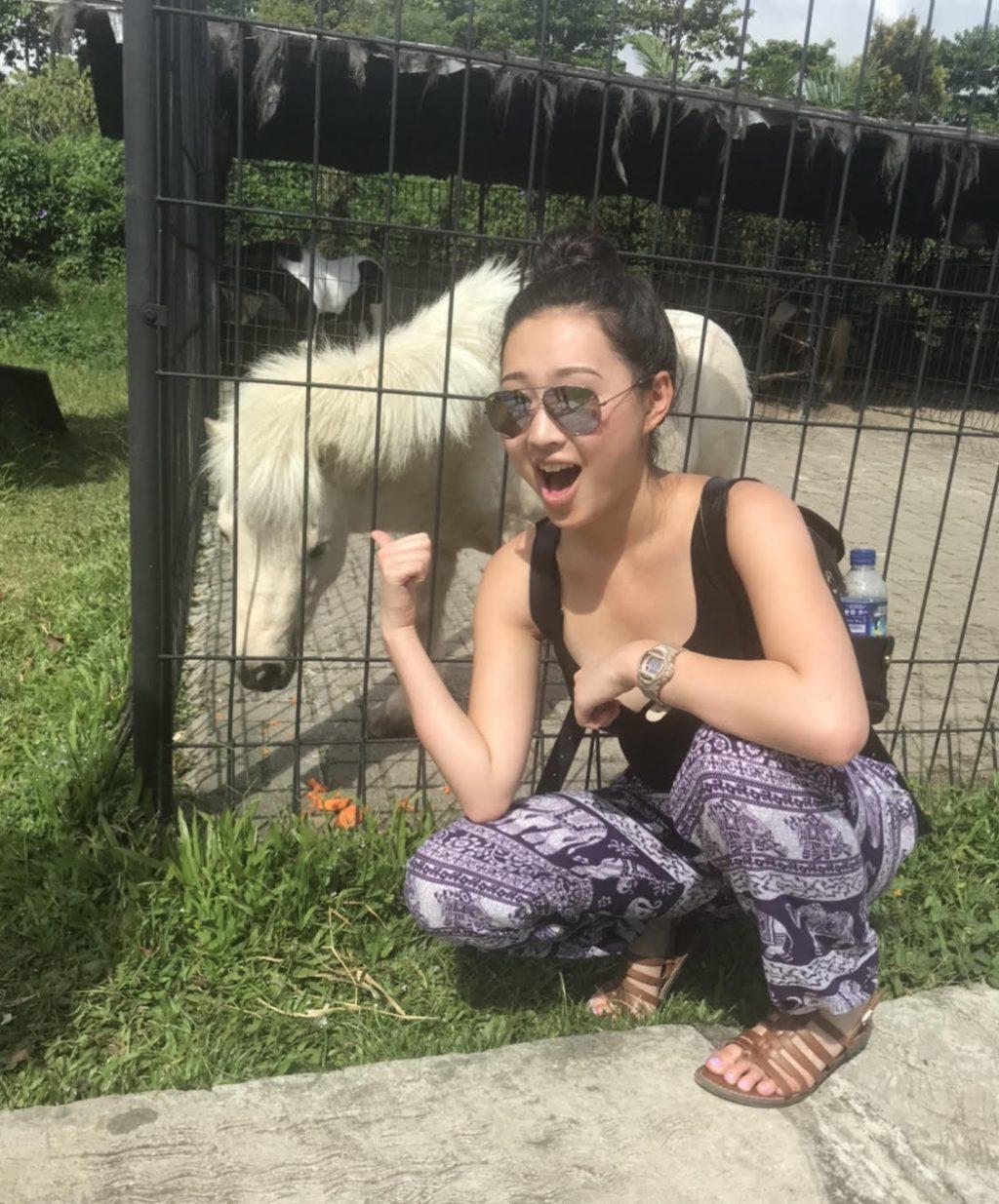 Chan poses with a miniature horse she found while hiking in the jungle in Indonesia in June 2018. Chan said she hopes to visit Asia again someday in the future.