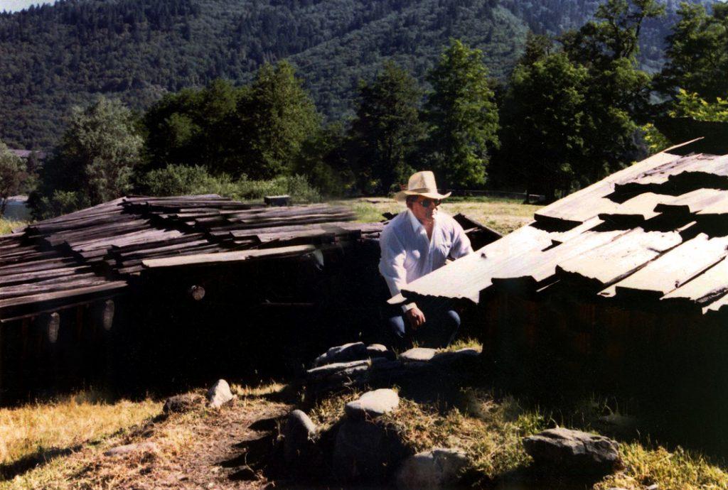 The late Wilfred K. Colegrove works on traditional cedar houses in the village of Takamildin. Colegrove was a Hoopa Valley Tribe Cultural Leader and Sasheen Shailee Colegrove Raymond's grandfather.