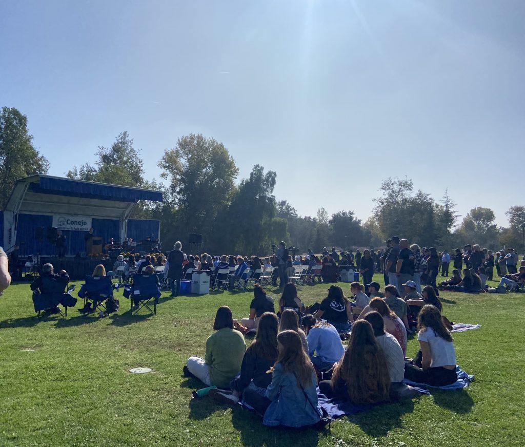 Community members sit at Healing Garden to honor and reflect on the victims of the Borderline shooting. The City of Thousand Oaks hosted the event for the third anniversary. Photo by Abby Wilt