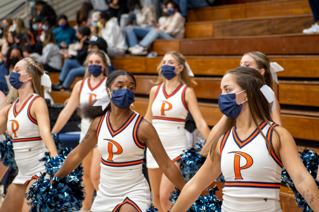 Squad captain Imani Barbary (center) leads a cheer at a Pepperdine Women's Basketball game Nov. 5. Cheerleading returned to Pepperdine in 2019 and has yet to have an uninterrupted year of activity.
