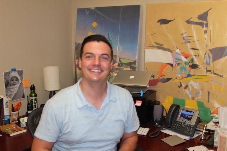 Graphic writer Alec McPike photographed Gus Peterson smiling in 2015 in his office at the Office of the Chaplain. Peterson worked at Pepperdine for six years prior to his layoff in February 2021. Graphic file photo