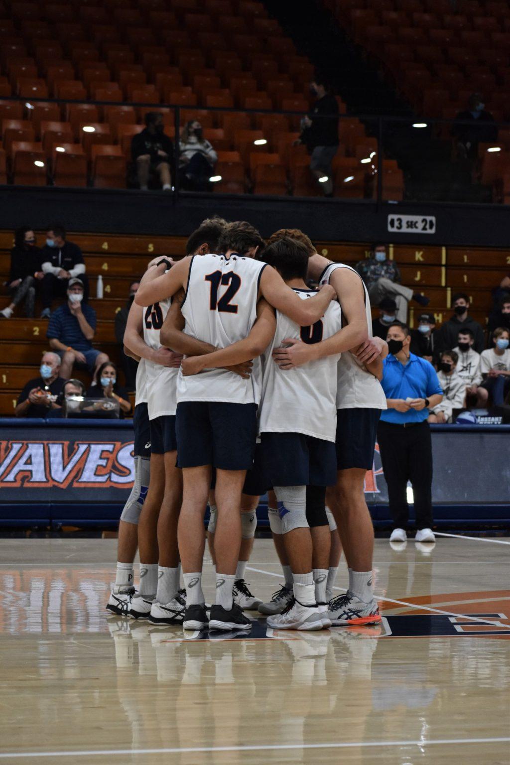 The Waves gather for a hug in between points during their match against UC Irvine in Firestone Fieldhouse on Feb. 9. The Waves bounced back from a slow start and won the match in straight sets, 25-21, 25-17, 27-25.