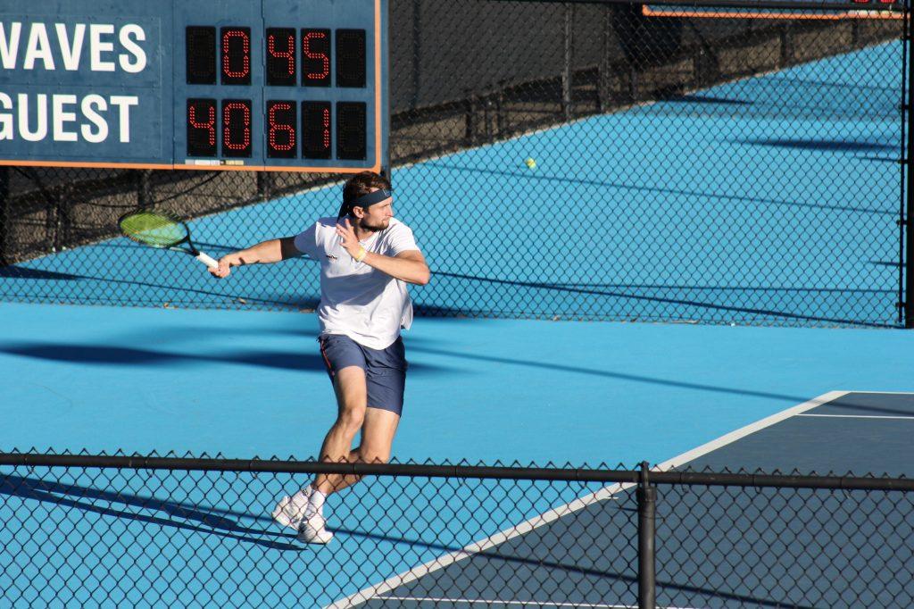 Graduate student Andrew Rogers readies a forehand in his singles match Jan. 23 against University of Arizona. Rogers lost his match in a deciding set, 6-4, 2-6, 6-3.