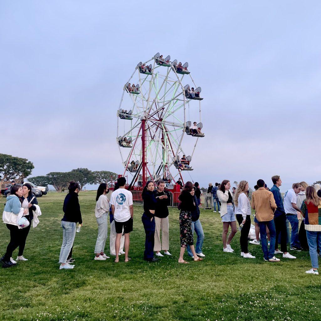 Students line up to ride the ferris wheel on Alumni Park. Pacific Sounds Music and Arts Festival brought in three performers — despite usually having two — to celebrate the festival being back in person since 2019. Photo by Liza Esquibias