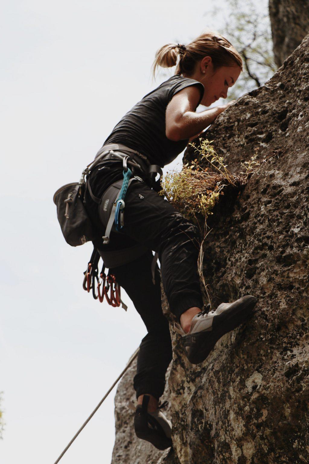 Junior Lindsey Forschner, director of education for Climbing Club, adjusts her position while lead climbing at Malibu Creek State Park in 2019. Numerous members said a primary goal of Climbing Club is to introduce the Pepperdine community to the sport of climbing. Photo courtesy of Lindsey Forschner