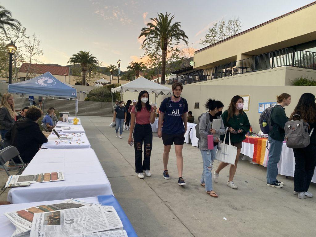 Pepperdine students explore clubs and organizations at the club fair. Students were able to interact with club leaders and engage with their club tables.