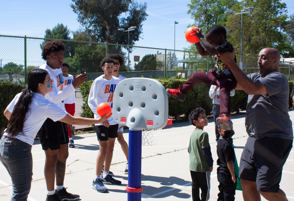 Pepperdine Men’s Basketball team helps kids score some major dunks. The children got a boost of adrenaline and stayed physically active while building their athletic skills and connecting with team members.