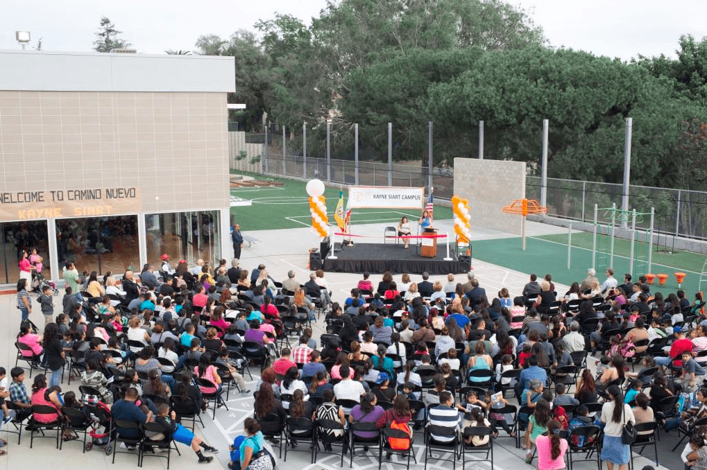 Community members gather at Molly Stoeckel's school, Camino Nuevo Kayne Siart Campus, for a ribbon-cutting ceremony. Photo courtesy of Kayne Siart's Website Photo Gallery