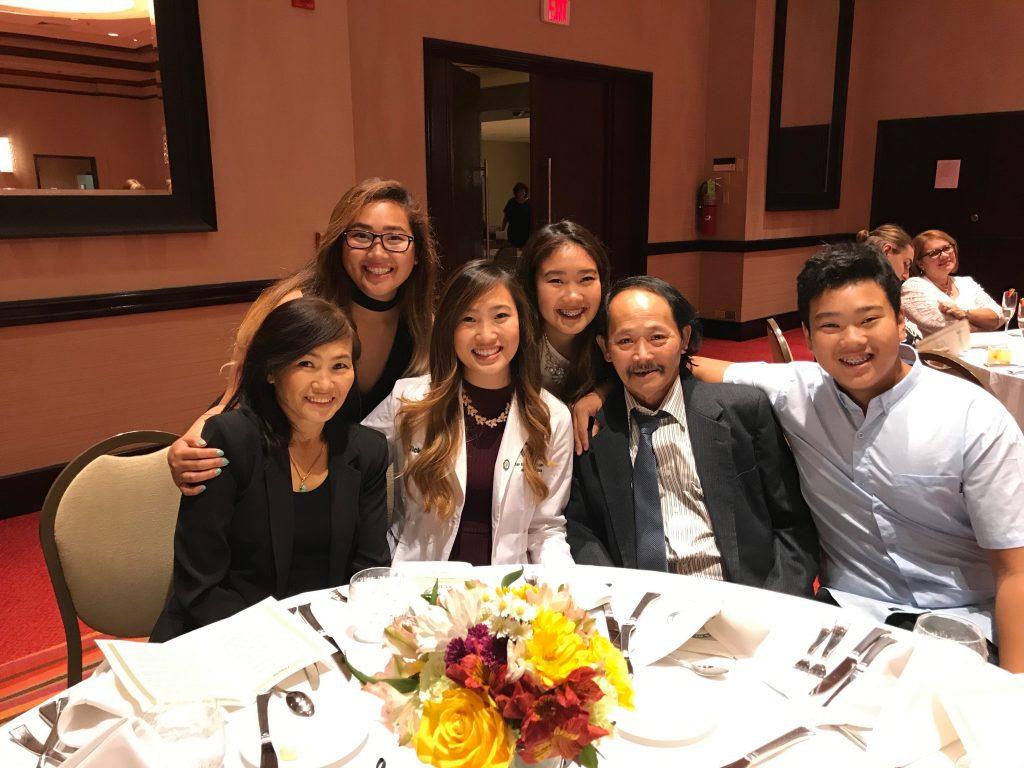 Garden Grove resident Amy Than smiles with her family at her sister's white coat ceremony in Puerto Rico. Than said she is scared her parents may be targeted and face discrimination in public because they do not speak English. Photo courtesy of Amy Than