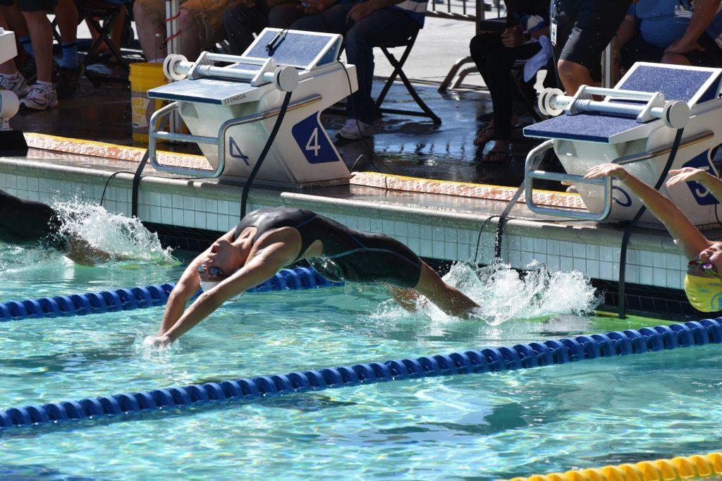 Freshman swimmer Tay Thomas competes in a fall 2019 swim meet. Thomas has been living on campus since August. Photo courtesy of Tay Thomas