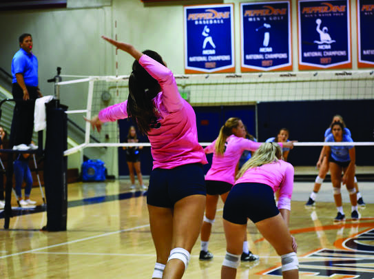 Sophomore Aubrey Roberts serves against University of San Diego opponents in October 2019 at Firestone Fieldhouse. Roberts said her routine this year is pretty similar from day to day: practice, class, homework, rest and repeat. Photo courtesy of Aubrey Roberts