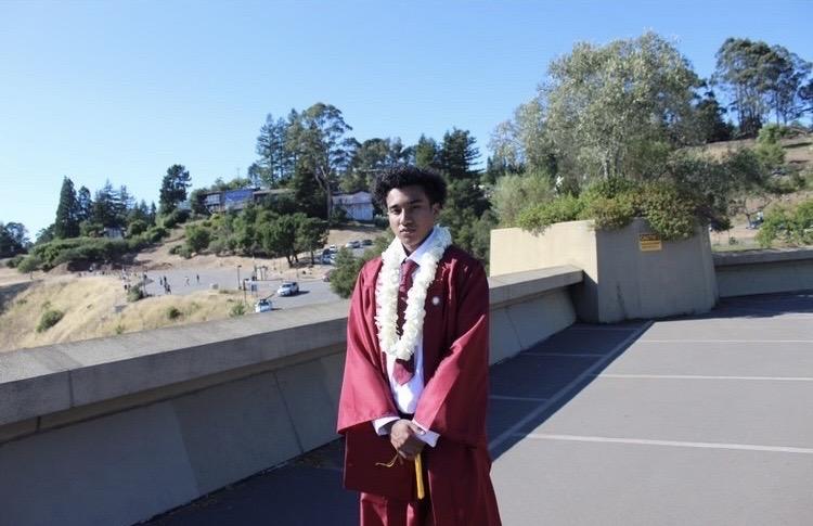 Miles poses in his maroon cap and gown for his graduation pictures at the Lawrence Hall of Science in Berkeley, CA, in June. At Pepperdine, he said he is hoping to learn as much as he can about psychology.