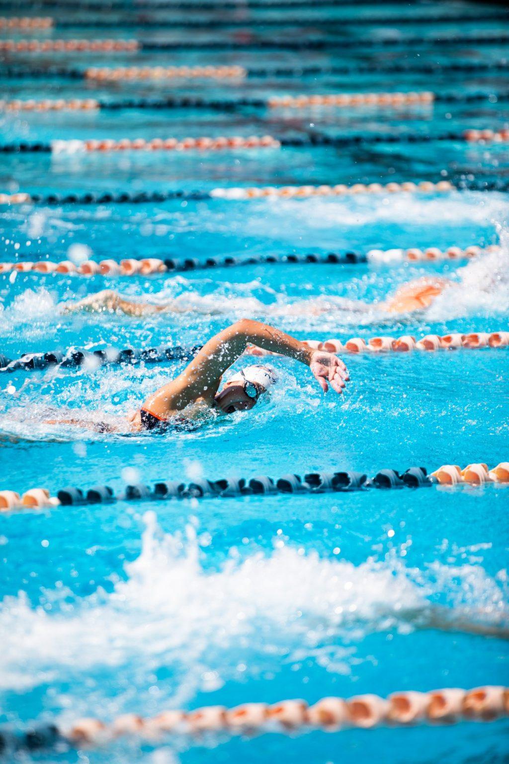 Junior Audrey Camarillo tilts her head to breathe during the 50-yard freestyle against Biola. Camarillo placed third in the event and also swam a 54-second 100-yard freestyle.