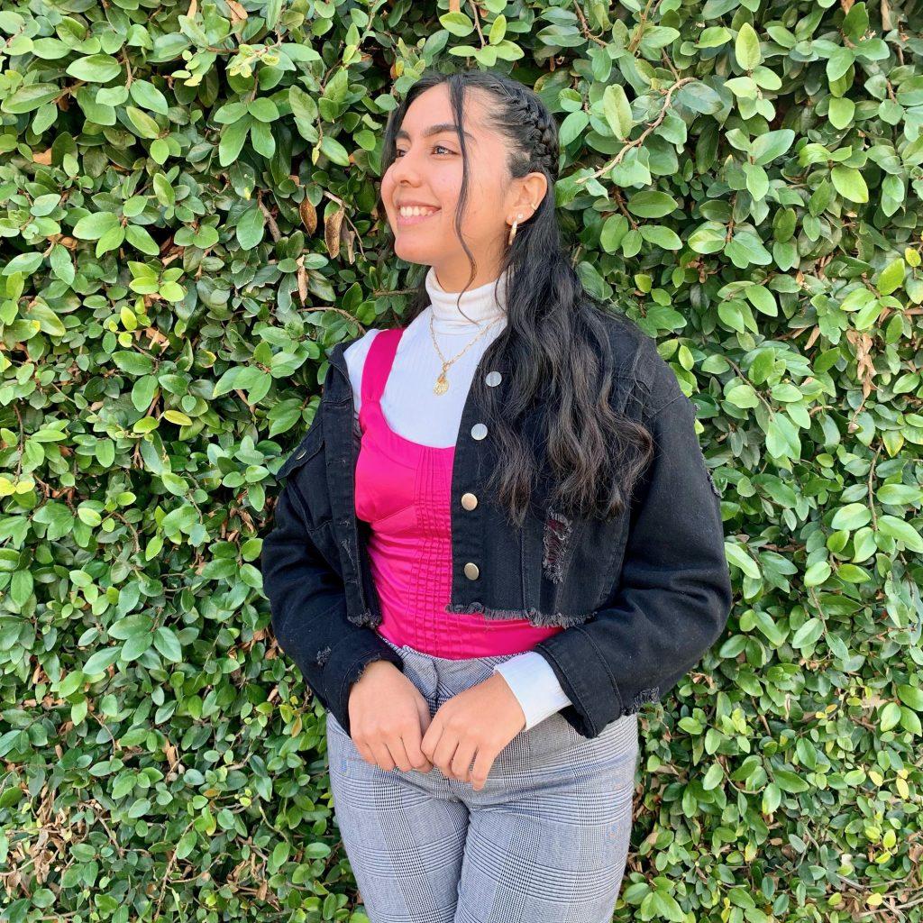 Junior Maria Chavez matches a bright pink tank top with a white turtleneck in January in Long Beach, Calif., for this fashionable look. Chavez said she loves experimenting with different styles and colors during the spring. Photo courtesy of Maria Chavez