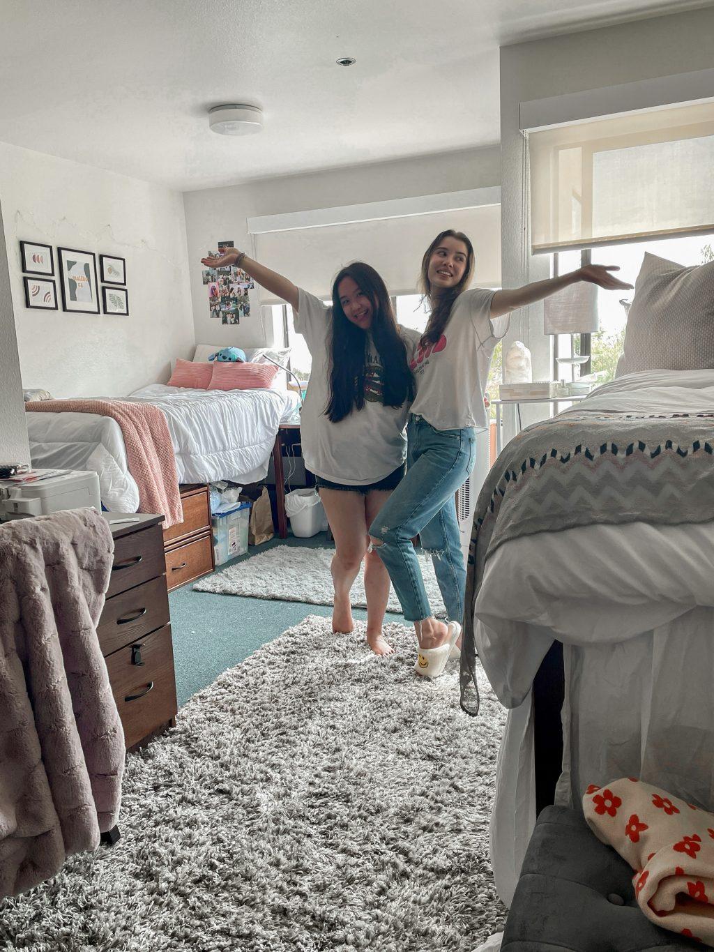 Sophomore Nathania Au and her roommate Liza Esquibias pose in their decorated room Aug. 24. Au said she and her roommate found inspiration for their room on Pinterest, TikTok and Instagram. Photo Courtesy of Nathania Au