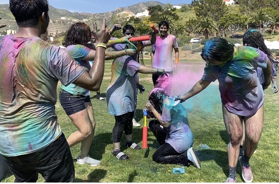 Students at the festival spray water and toss colored powder at one another. Through these activities, students said they learned more about how South Asian cultures interact. Photo by Christina Buravtsova