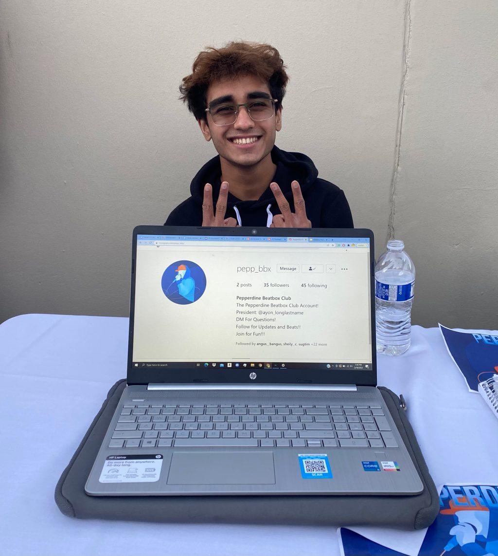 First-year Ayon Wickramasinghe displaying the Instagram account for his new Beatbox Club at the club fair Feb. 18. Wickramasinghe attended the club fair to gain exposure and grow club membership.
