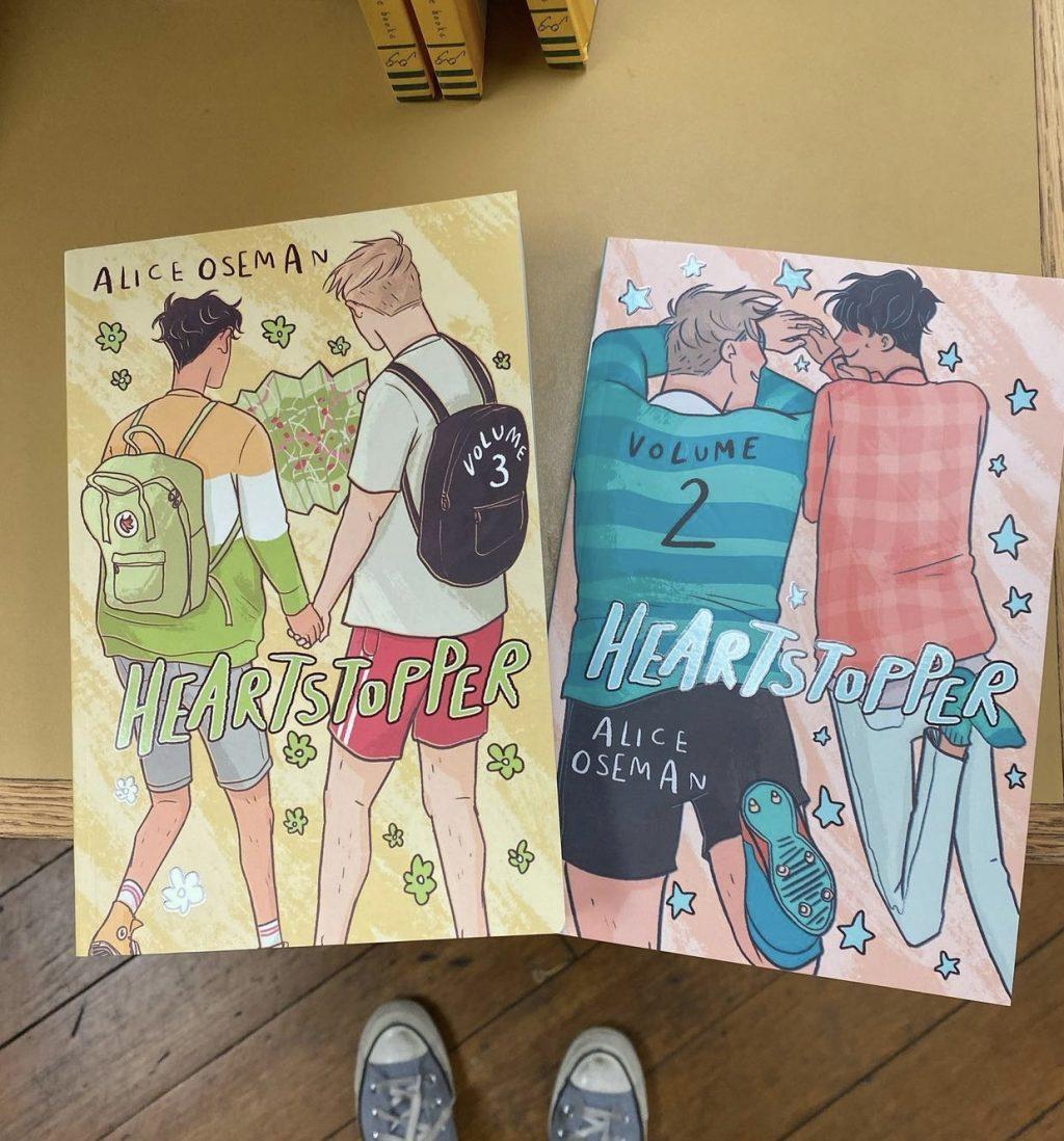 The second and third graphic novels of the “Heartstopper” series sit in a bookshop in Dundee, Ore. Both novels featured characters Nick Nelson and Charlie Spring as they interact with each other with colorful clothes and backgrounds. Photo by Jackie Lopez