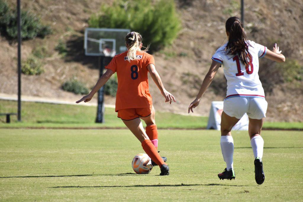 Little dribbles the ball past her defender Oct. 29 at Tari Frahm Rokus Field. Little scored in the 90th minute of the game thanks to a cross from senior defender Trinity Watson.