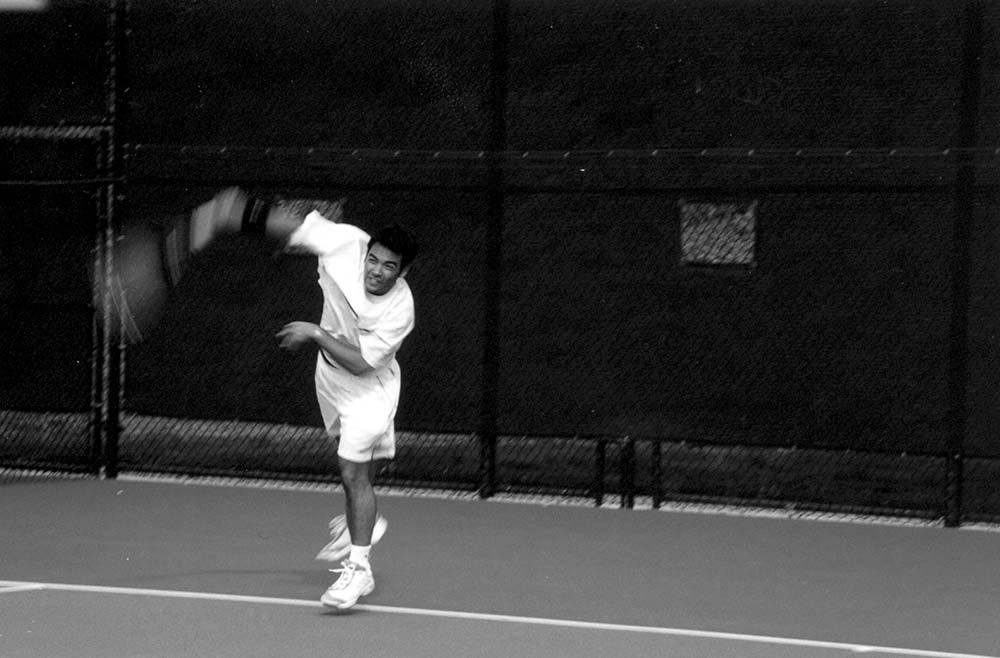 Partha Bhattacharya fires a serve