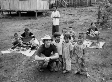 Physical Education coordinator Michael Anderson with children in Thailand