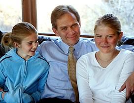 Elizabeth Smart, right, with sister Mary Katherine and father Ed at their home Thursday.