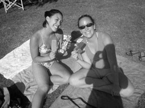 Sheena Torres (left) and Meg Shoji take a break from studying to catch some rays. Photo/Courtesy bawaves.com