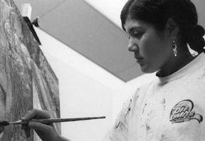 Jennifer Baggs put the finishing touches on one of her paintings. Photo/Micah Kafka