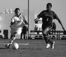 2 girls dribble ball