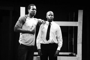 IN THE MOMENT - Actor Terrance Colby Clemons clutches his chest with great distress as his character, Wade, struggles to pull himself together. The actor duo portray two interviewees for a construction jobin alumna Julie Taiwo Oni's ('06) play "BUNK."