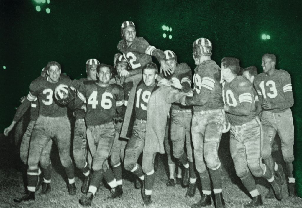 Football_player_Terry_Bell_being_carried_by_team_mates_1948