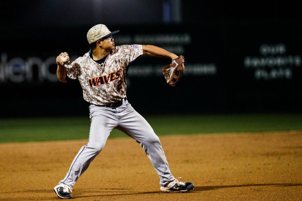 Sophomore infielder Wyatt Young throws from shortstop during a Feb. 18, game against Cal Poly. Pepperdine Baseball was 12–3 and ranked No. 16 in the nation when their season ended due to COVID-19. Photo courtesy of Owen Main | fansmanship.com