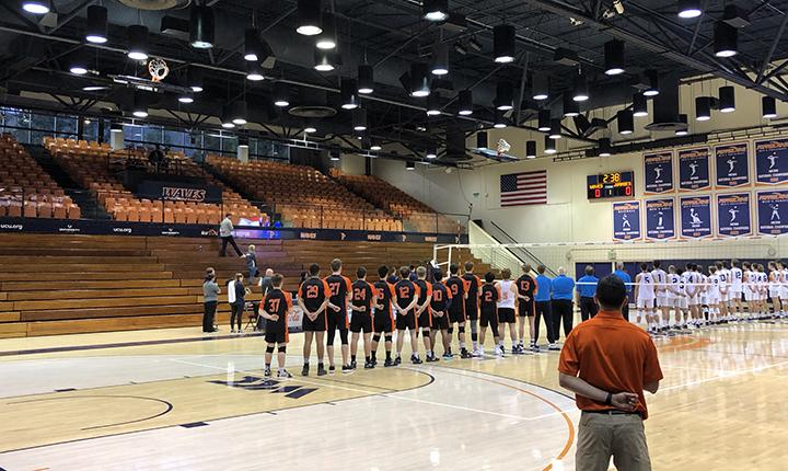 An abnormally sparse crowd stands for the national anthem prior to Pepperdine Men's Volleyball's match March 12 at Firestone Fieldhouse. The Waves defeated Jamestown 3–0 in the first, and only, Athletics event with attendance restrictions. Little did the teams know, it would be the final Athletics event at Pepperdine for the remainder of the spring 2020 semester. Photo by Karl Winter