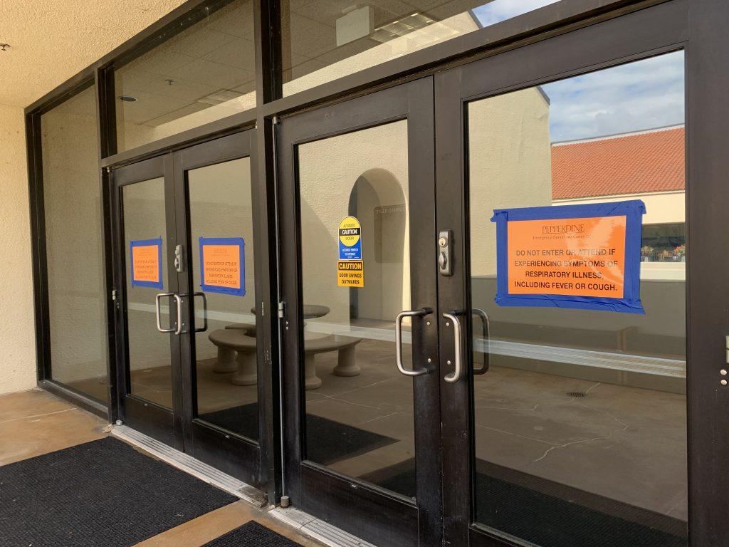 Signs that read "Do not enter or attend if experiencing symptoms of respiratory illness, including fever or cough" are posted on all entrances to Pepperdine buildings.