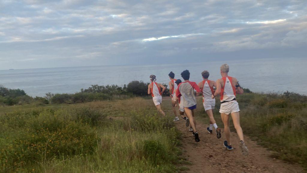 Members of Pepperdine's Men's Track team run down the Malibu Bluffs on Sunday. Seven of the team members ran 26.2 miles from Pepperdine's campus to Playa del Rey as a final act of closure for the seniors. Photo courtesy of Preston Gromer