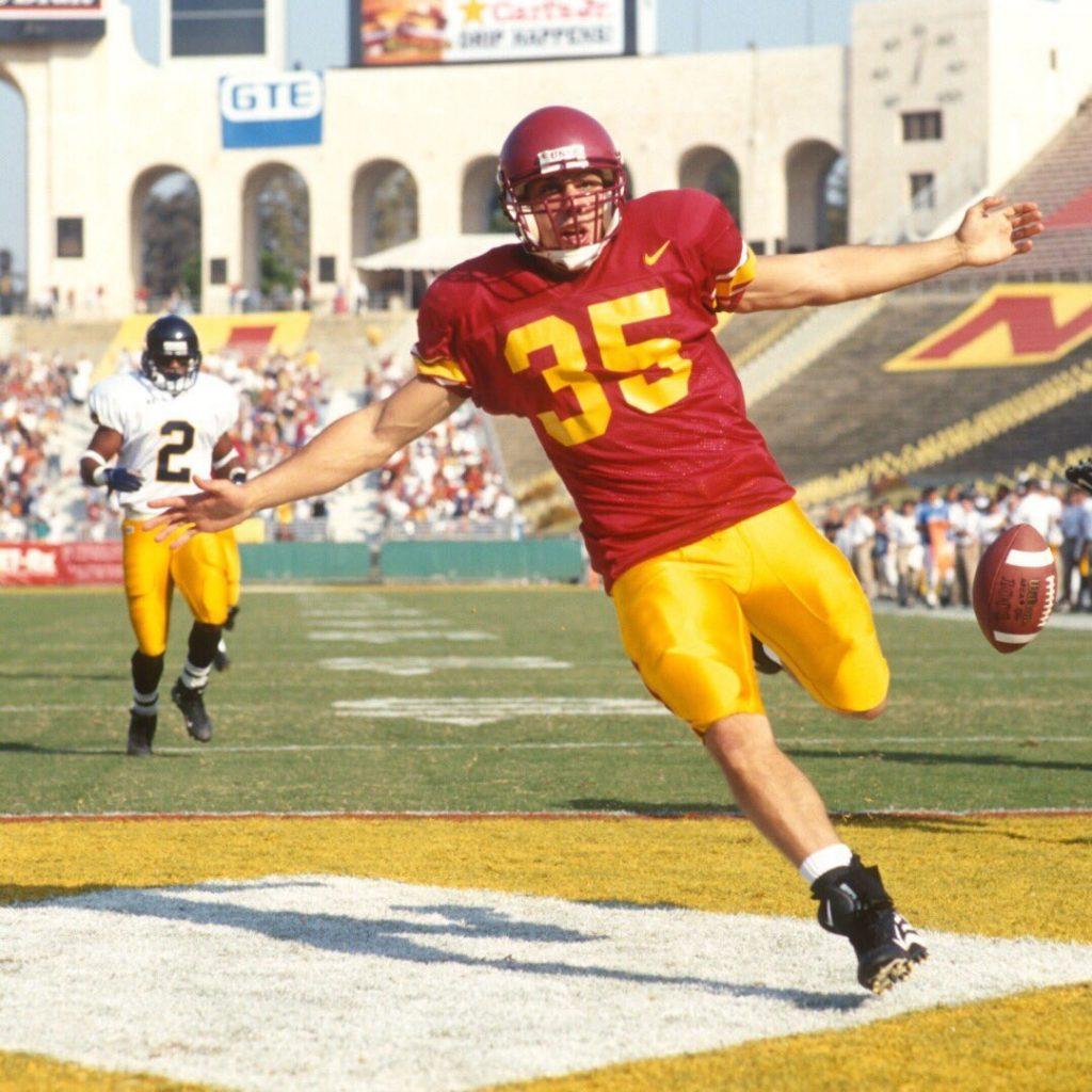 Papadakis celebrates a rushing touchdown versus Cal Berkeley in the L.A. Memorial Coliseum in 2000. Photo courtesy of @theoldp on Twitter