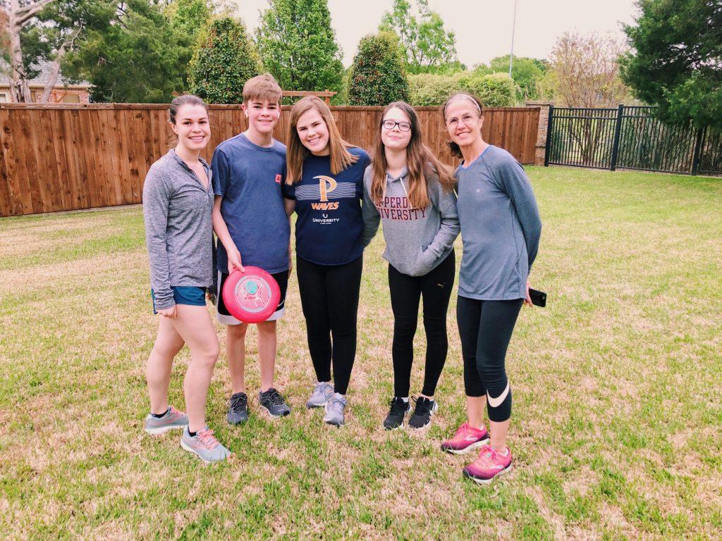 Kelli Brickner (middle) plays a game of frisbee with her siblings. Since leaving Pepperdine and returning to her home in Texas, Brickner enjoys getting fresh air and spending time with her family. Photo Courtesy of Kelli Brickner