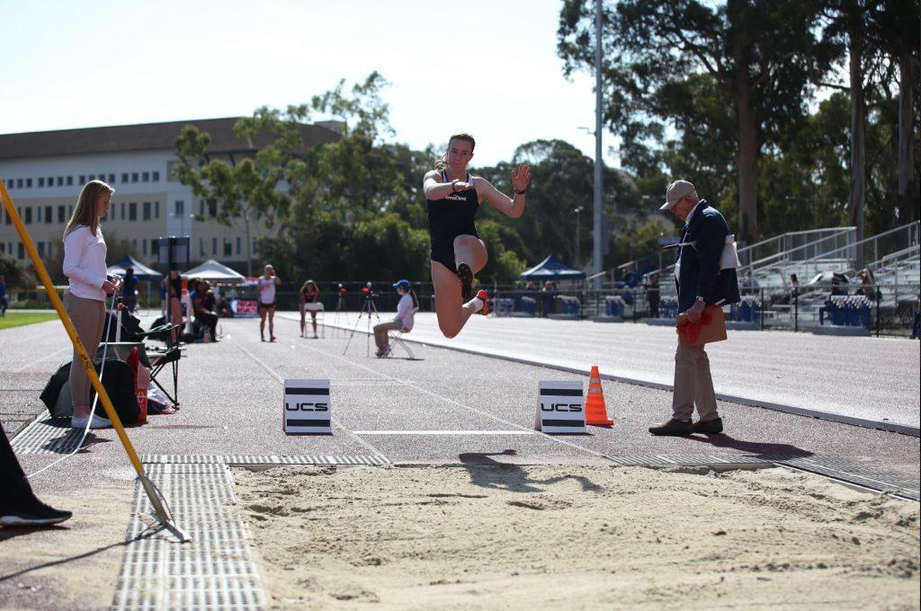 O'Malley does the long jump at an outdoor track meet. Before her season was cut short, O'Malley also ran the 100m, 200m, and 400m for the Waves. Photo courtesy of Katie O'Malley.