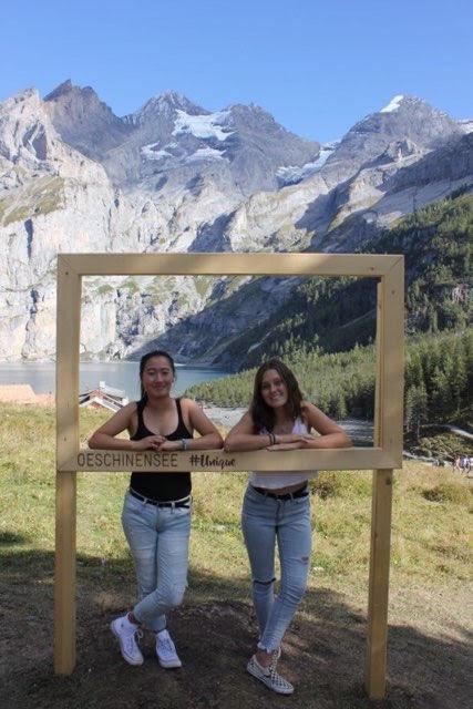 Lausanne students Alicia Yu (left) and Emily Stephens (right) pose in front of the Swiss Alps, a trademark of the Lausanne program. Photo courtesy of Alicia Yu